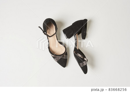 Pair of elegant women high heel shoes on white floor. View from above. Womens high heels and platform shoes. Stylish female high heels 83668256