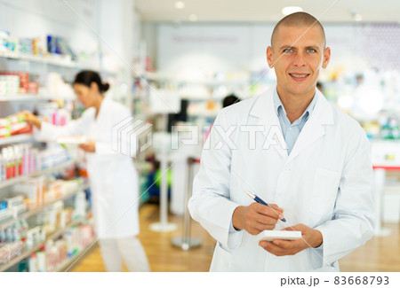 Doctor standing in chemist shop 83668793