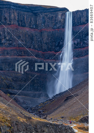 Hengifoss waterfall with red lines in the rocks, long exposure Hengifoss waterfall with red lines in the rocks, long exposure 83669407
