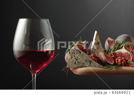 Red wine with blue cheese, figs, walnuts, and rosemary. 83669921