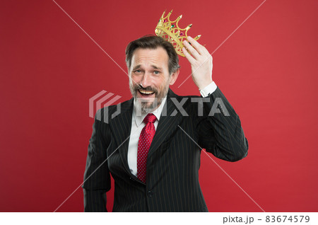 Winner at life. Successful prize winner putting crown 83674579