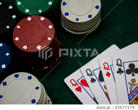 poker game table, four queens with playing chips 83675579