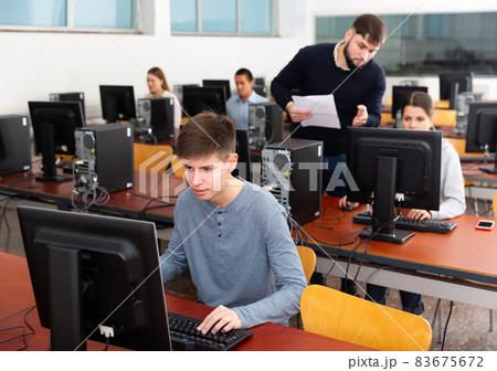 Young male student works at computer 83675672