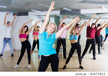adults of different ages dancing at dance class 83675812