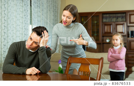 Wife scolds her husband in the presence of a child 83676533