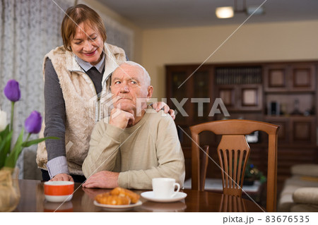 Woman asking for forgiveness from offended husband 83676535