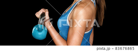 Fitness exercise crossfit woman lifting kettlebell weights strength training workout at gym panoramic banner of black chalkboard texture blackboard background. 83676865
