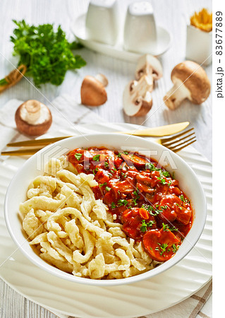 spaetzle with mushroom gravy in a white bowl spaetzle with mushroom gravy in a white bowl 83677889