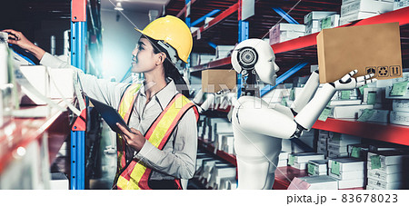 Innovative industry robot working in warehouse together with human worker 83678023