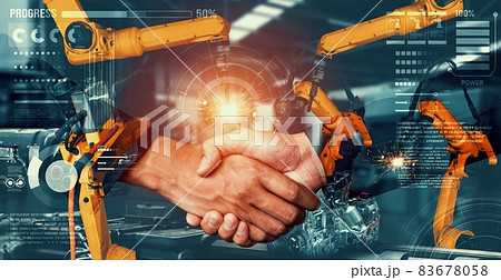 Mechanized industry robot arm and business handshake double exposure 83678058