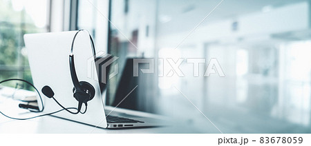 Headset and customer support equipment at call center ready for actively service Headset and customer support equipment at call center ready for actively service 83678059