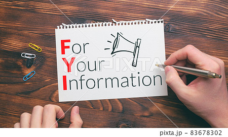 Business acronym FYI or For Your Information. Person writes text on paper 83678302