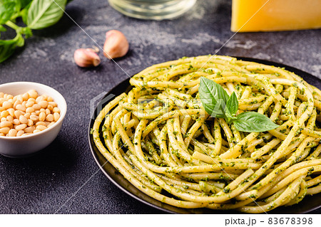 Pasta spaghetti with pesto sauce and fresh basil leaves Pasta spaghetti with pesto sauce and fresh basil leaves 83678398