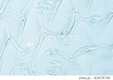 Cosmetic gel or beauty jelly serum texture background. Transparent skin care collagen product backdrop. Antibacterial sanitizer or liquid water moisture toner smudged smear close up photo Cosmetic gel or beauty jelly serum texture background. Transparent skin care collagen product backdrop. Antibacterial sanitizer or liquid water moisture toner smudged smear close up photo 83678796