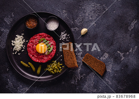 fresh beef tartar with tasty vegetables fresh beef tartar with tasty vegetables 83678968