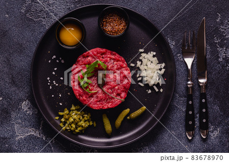 fresh beef tartar with tasty vegetables 83678970