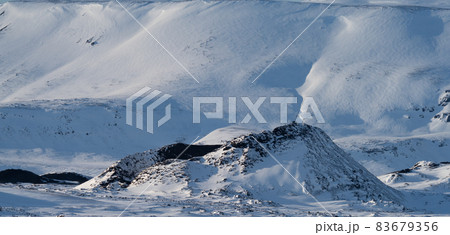 Volcano perfect crater covered by snow, profile view Volcano perfect crater covered by snow, profile view 83679356