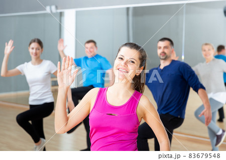 Woman training at group dance class Woman training at group dance class 83679548