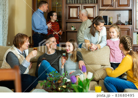 Happy family having conversation together 83680495