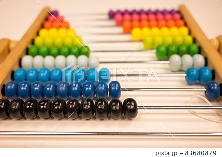 Bright colored hand abacus. Children's wooden toy for the study of arithmetic. 83680879