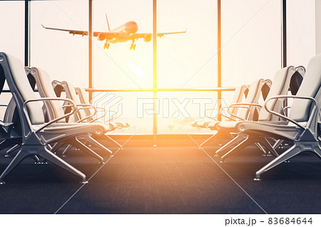 Empty chair in airport terminal gate with window sunset light background. Travel adventure and vacation freedom concept. 83684644