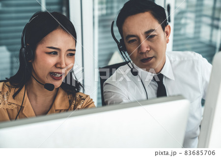 Business people wearing headset working actively in office 83685706