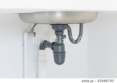Drain pipe or sewer under kitchen sink in drainage system. Drain pipe or sewer under kitchen sink in drainage system. 83686795