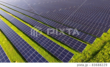 Aerial drone view flight over solar power station panels. Aerial drone view flight over solar power station panels. 83688229