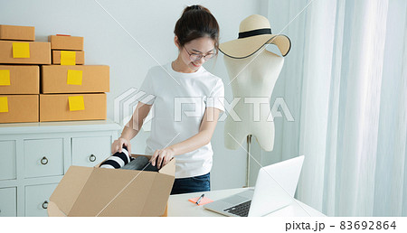 Young asian girl is freelancer with her private business at home office Young asian girl is freelancer with her private business at home office 83692864