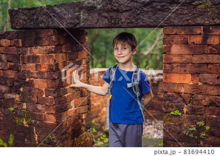 Boy tourist in Temple ruin of the My Son complex, Vietnam. Vietnam opens to tourists again after quarantine Coronovirus COVID 19 83694410