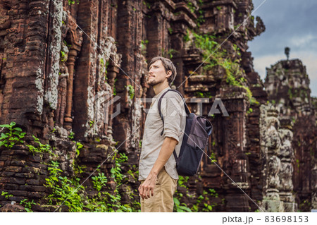Man tourist in Temple ruin of the My Son complex, Vietnam. Vietnam opens to tourists again after quarantine Coronovirus COVID 19 83698153