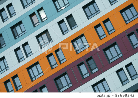 Texture, design and right geometry of new modern residetial building exterior in the city Moscow in autumn day. Modern construction. Close up photography. Orange and violet colors in the design Texture, design and right geometry of new modern residetial building exterior in the city Moscow in autumn day. Modern construction. Close up photography. Orange and violet colors in the design 83699242