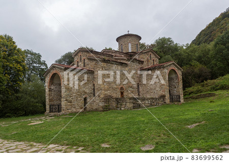 Old, abandoned temple in the Caucasus. 83699562