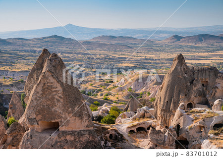 Cappadocia valley with cave houses in the foreground Cappadocia valley with cave houses in the foreground 83701012