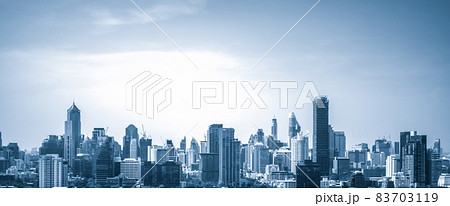 Blue-filtered cityscape and high-rise buildings in metropolis city center 83703119