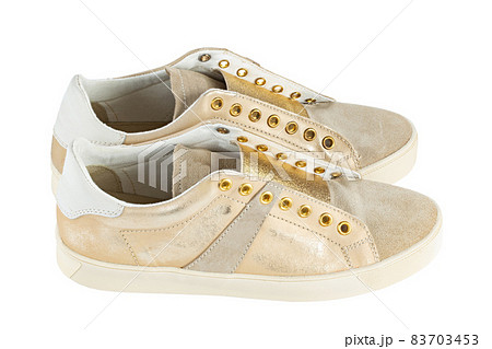 Stylish womens sneakers isolated white background. Stylish womens sneakers isolated white background. 83703453