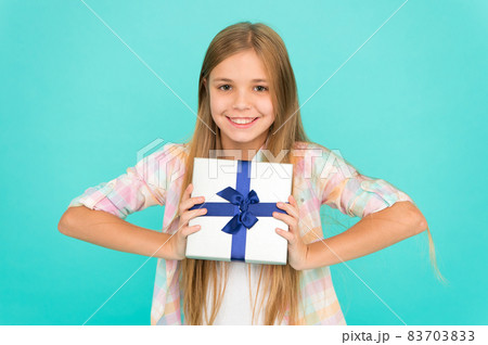 On boxing day. Small girl after shopping for gift. Little  83703833