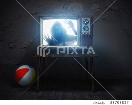 Horror scary movie concept. Ghost silhouette on screen of vintage tv in haunted house. 83703837