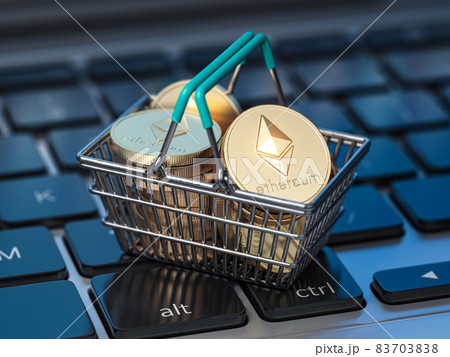 Ethereum coins in shopping basket on laptop keyboard. Ethereum wallet and payment. 83703838