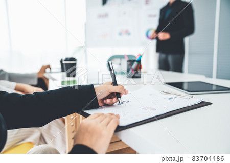 Businesswoman in business meeting writing paper proficiently at office room . Businesswoman in business meeting writing paper proficiently at office room . 83704486