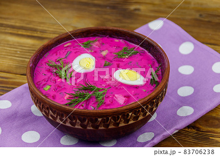 Cold beetroot soup on a wooden table 83706238