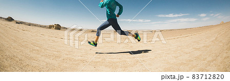 Fitness woman trail runner cross country running on desert Fitness woman trail runner cross country running on desert 83712820