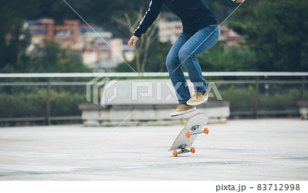 Skateboarder skateboarding outdoors in city Skateboarder skateboarding outdoors in city 83712998