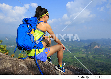 Successful woman hiker enjoy the view hiking on mountain peak Successful woman hiker enjoy the view hiking on mountain peak 83713095