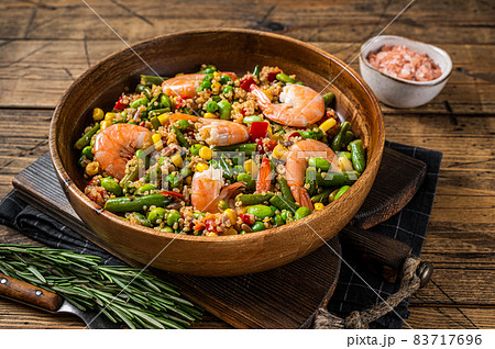 Diet menu, Vegan food. Healthy salad with quinoa, vegetables and Shrimps Prawns. Wooden background. Top view 83717696