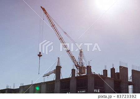 Aerial top view of construction site new multi-storey buildings tower crane with unfinished high-rise building 83723392