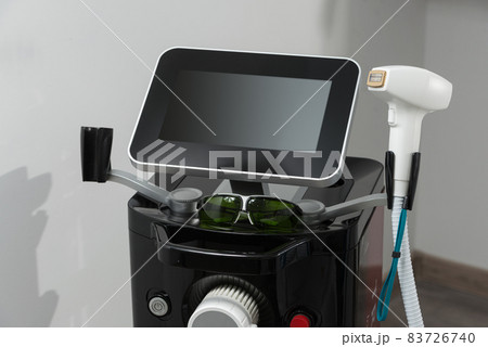 Modern equipment for laser hair removal in a beauty salon. Beauty salon and cosmetology Modern equipment for laser hair removal in a beauty salon. Beauty salon and cosmetology 83726740