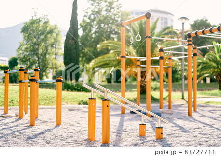 Outdoor sports ground with a variety of horizontal bars Outdoor sports ground with a variety of horizontal bars 83727711