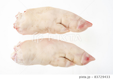 Two raw pork legs for cooking isolated on white background. Studio Photo 83729433