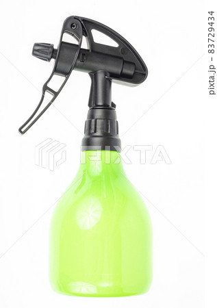 Green garden hand plant sprayer isolated on white background. Disease and pest control. Studio Photo 83729434